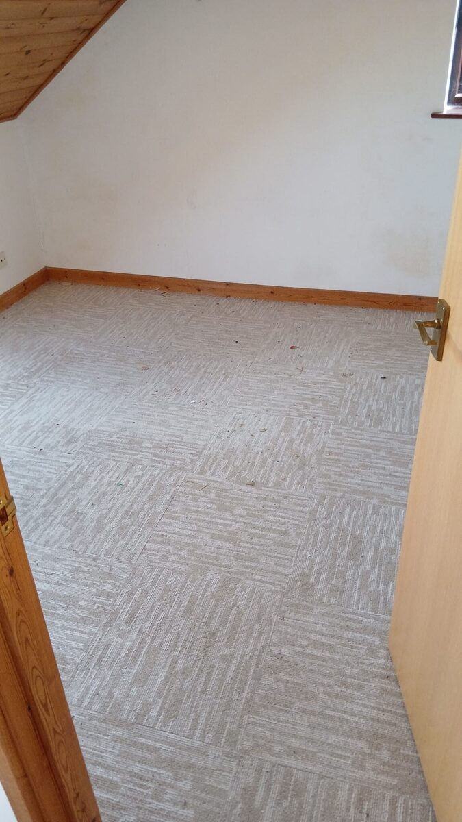 After photo showing a clean, empty room after expert clearance